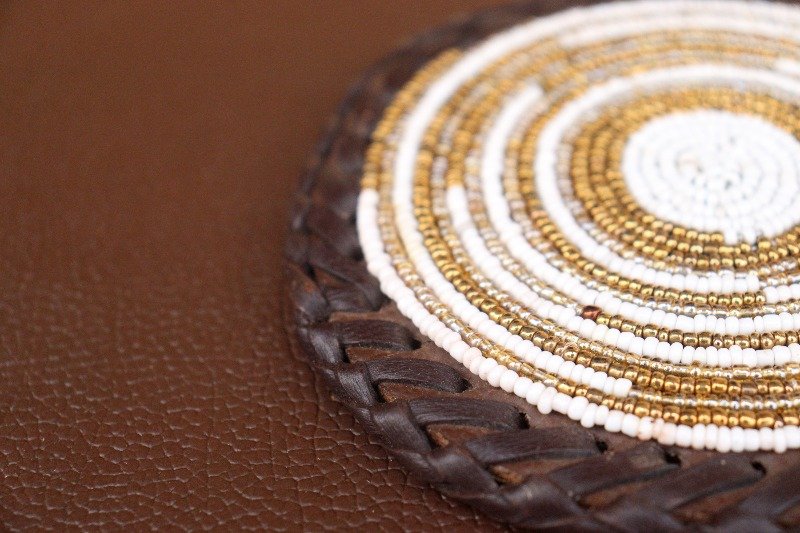 Durable Gold and White Beaded Coaster with Leather Trim