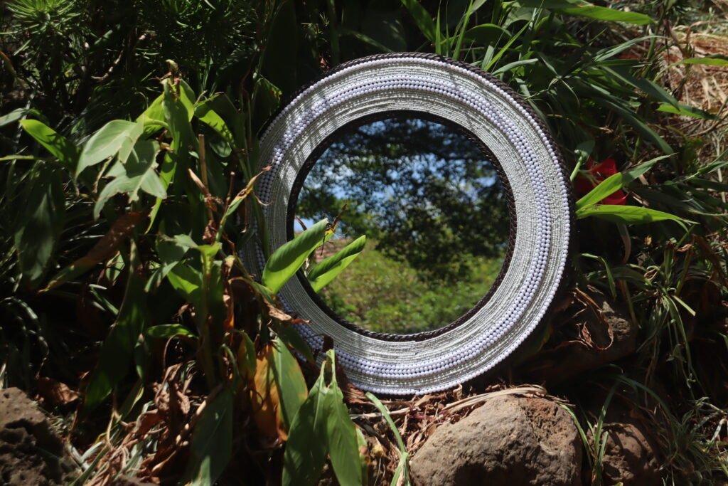 Beaded mirror catching natural light